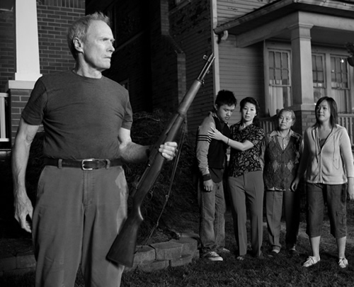 Clint Eastwood defending his neighborhood in Gran Torino. © 2008, Warner Bros.