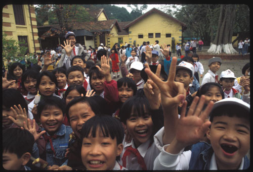 Hanoi school kids give peace welcome to a former “enemy.” ©1997, UrbisMedia