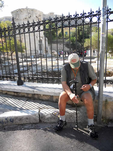A man mourns loss of a taverna beside the agora and Temple of the Four Winds.