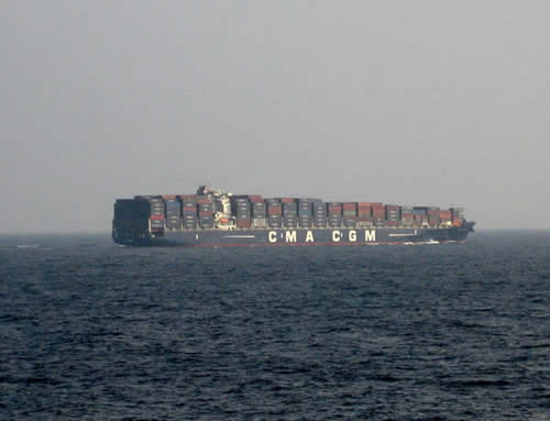 The chariots of globalism; container ship in the Andaman Sea © 2011, UrbisMedia